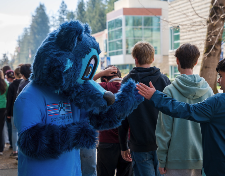 Lobo Greeting Students First Year Learning