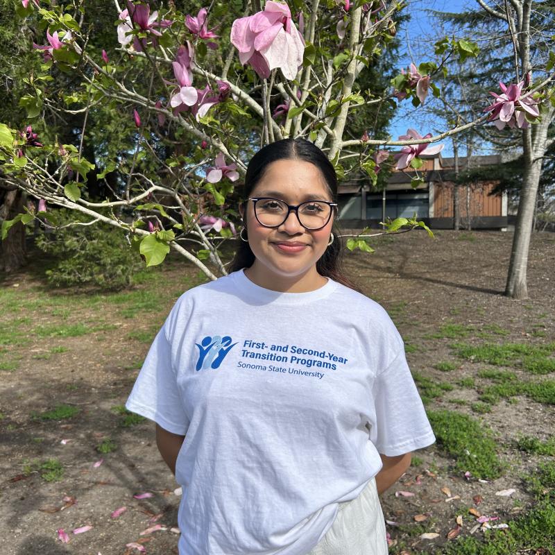 Woman looking ahead, wearing a t-shirt that says First- and Second Transition Programs.